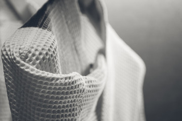 bathrobe in hotel closet, monotone