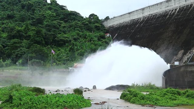 Water rushing splash through the spillway gate of Khun Dan Prakan Chon dam (Khlong Tha Dan Dam) is the largest dam in Thailand 