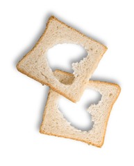 Two Slices of white bread with hearts isolated on white