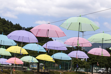 Colorful umbrellas background. Colorful umbrellas in the sky.