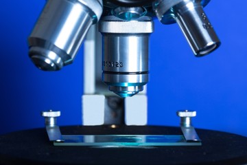 Closeup of Microscope Lenses and Slide