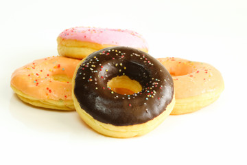 Donuts on white table background.
