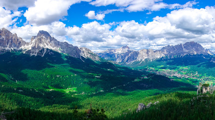 The panorama view of green hill with Passo Pordoi peak, South Tyrol, Dolomites, Italy.