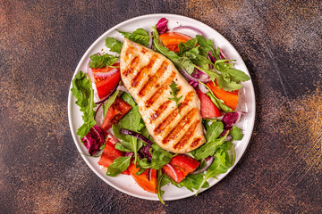 Chicken breast with fresh salad.
