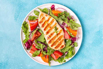 Chicken breast with fresh salad.