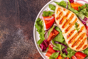 Chicken breast with fresh salad.