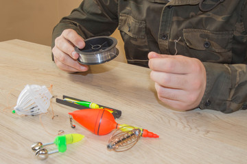 Fisherman prepare to fishing. Fishing tackle - fishing spinning, hooks and lures