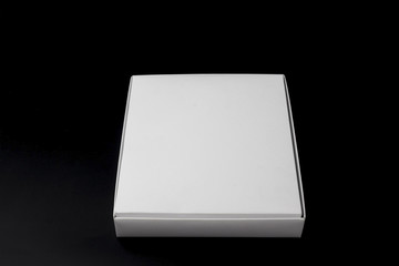 white box isolated on black background close up