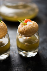 Pani Puri is an indian road side chat item - 4 stuffed puris kept over small glasses filled with mint water