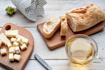 Preparation of sandwich with butter, cheese and red fish