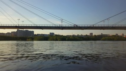 Aerial view under footbridge over the Yenisei river Krasnoyarsk drone footage