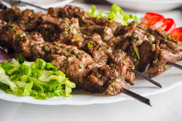 Traditional arabic lamb kebab with salad in morocco