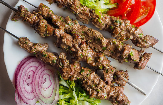 Traditional arabic lamb kebab with salad in morocco