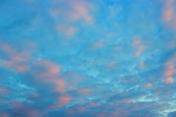 Fototapeta na wymiar View on beautiful pink clouds in a pink blue sky.