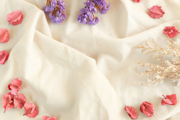 Soft focus of flowers on fabric background of Copy space. Can use for text message , text card, logo , product , etc.