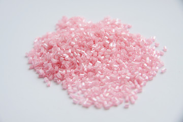 pink beads for craft on isolated background