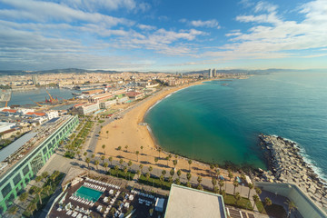Obraz premium Aerial view of Barcelona Beach in summer day along seaside in Barcelona, Spain. Mediterranean Sea in Spain.