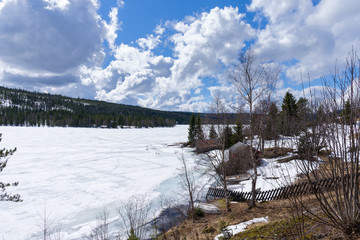 Shacks near a frozen lake