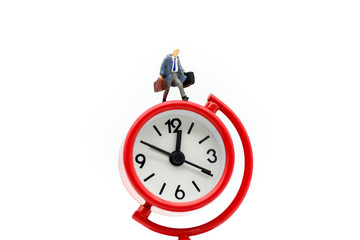 Miniature people : Businessman watching the time using for concept Be Late For Something Day.