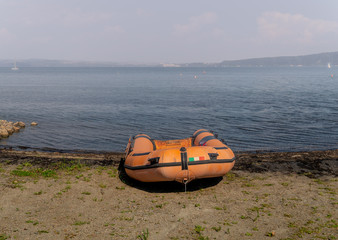 Empty rubber dinghy on the beach