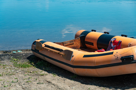 Empty Rubber Dinghy On The Beach