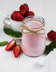Jar with strawberry yogurt