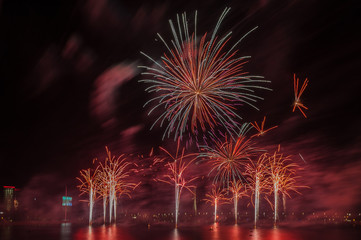 Magnificent fireworks over the River Daugava. Riga, Latvia. Long exposure. Copy space.