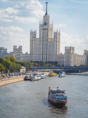 Fototapeta premium Panoramic view from above to Moscow: the road and a lot of cars, Stalin's skyscrapers
