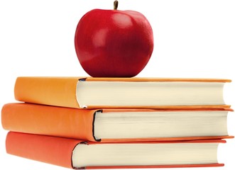 Bunch of books with an apple on top