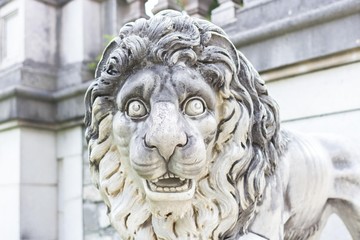 Marble sculpture. White stone lion. Architecture of the Middle Ages. European monuments. An ancient attraction. Peles Castle in Europe. Sculpture of an animal.