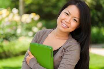 Obraz premium Portrait of a Student Woman in the Park