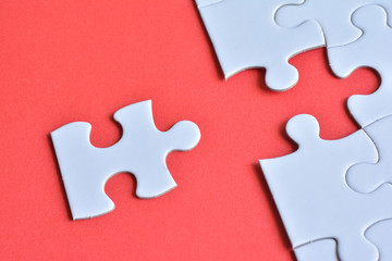 Jigsaw puzzle on a red background