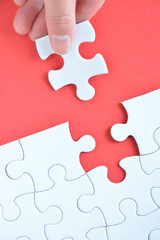 Jigsaw puzzle on a red background



