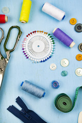 Sewing accessories on a blue  background