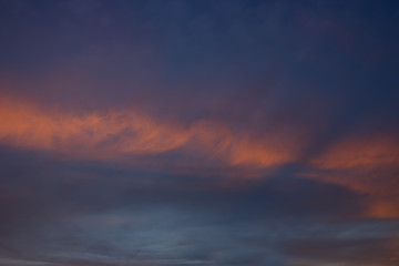 View on beautiful pink clouds in a pink blue sky.