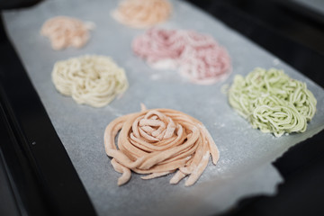 colored noodles green pink orange