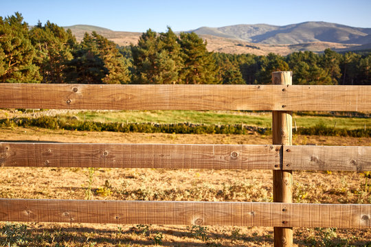 Wood fence on a countryside background
