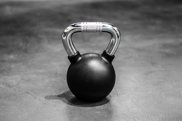 Obraz na płótnie Canvas health and sport lifestyle concept, steel athletic kettlebell weight in a black shell