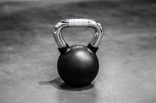 health and sport lifestyle concept, steel athletic kettlebell weight in a black shell