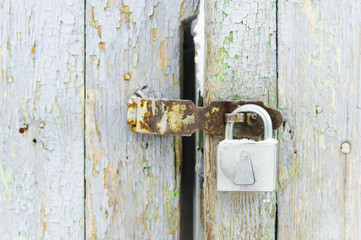Padlock on the old door