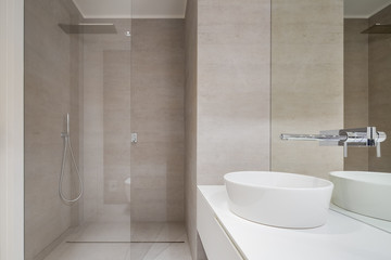 Beige bathroom with shower