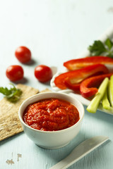 Roasted pepper dip with crisps and vegetables