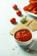 Roasted pepper dip with crisps and vegetables