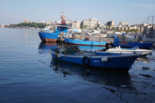 Fishing boats moored in the harbour of the Italian city Taranto