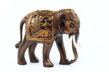 gold and brown elephant made of resin like wood carving with candle holder with white sesame. Stand on white background, Isolated, Art Model Thai Crafts, For decoration Like in the spa.