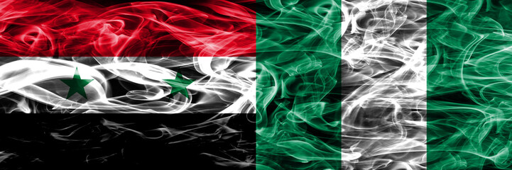 Syria vs Nigeria smoke flags placed side by side. Thick colored silky smoke flags of Syrian and Nigeria