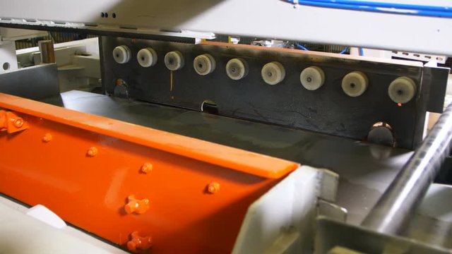 close view shining metal sheets for barrels on conveyor