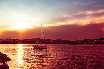 Sailboat entering Mataró dock, Costa del Maresme, Catalunya
