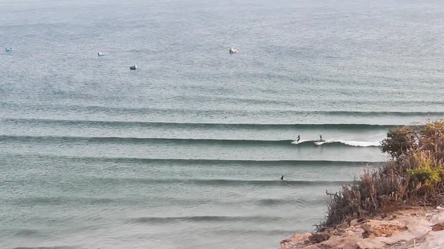 Friends Surfing in Imsouane, Morocco