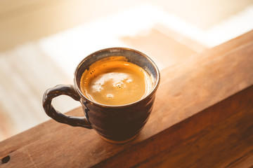 vintage hot coffee in cup on wooden.